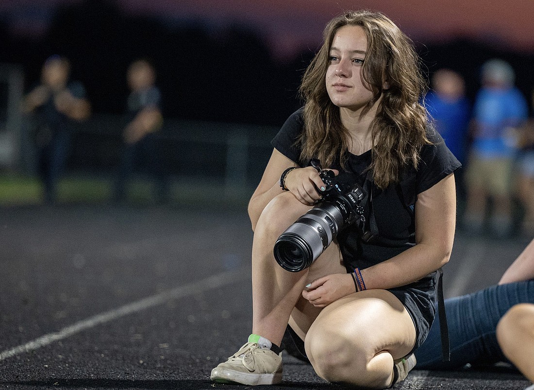 Sophomore Julia Farris, a talented and dedicated young photographer, has secured a remarkable 4th place nationally in the competition for her captivating photo, "From the Stands."