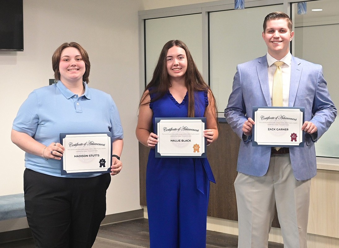 Seen here are essay contest winners Madison Stutts, Hallie Black and Zack Garner. Black won first-place honors, and Garner and Stutts respectively took home second and third-place honors.